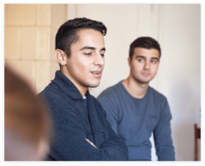 man speaking in a support group